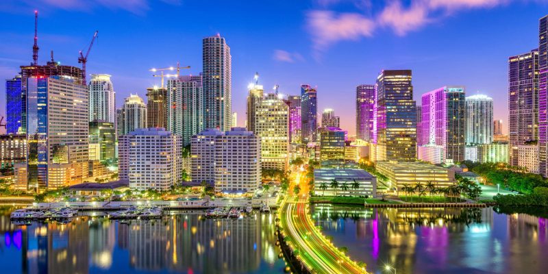 Miami, Florida, USA downtown skyline over Biscayne Bay at night.
