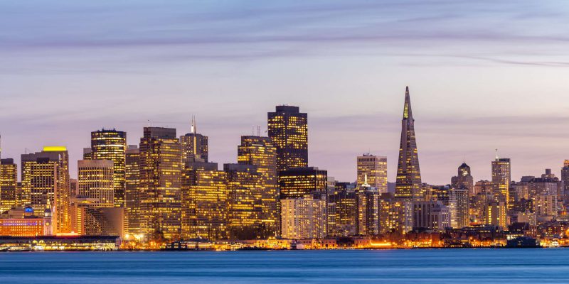 San Francisco downtown skyline at dusk from Treasure Island, California, sunset, USA. Panorama