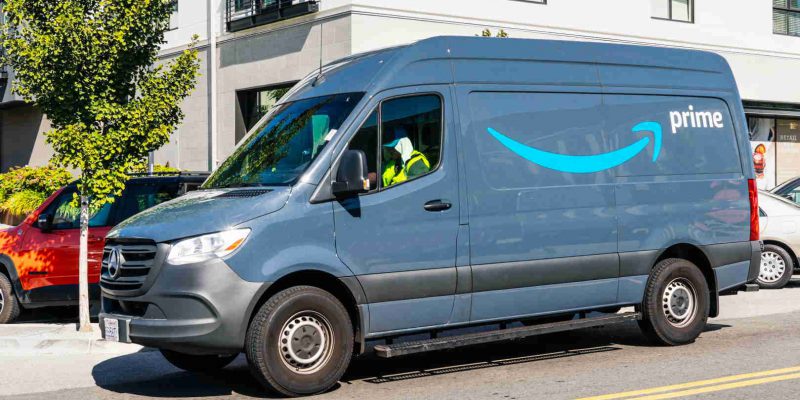 August 24, 2019 San Mateo / CA / USA - Amazon van branded with the Amazon Prime logo, making deliveries in San Francisco bay area